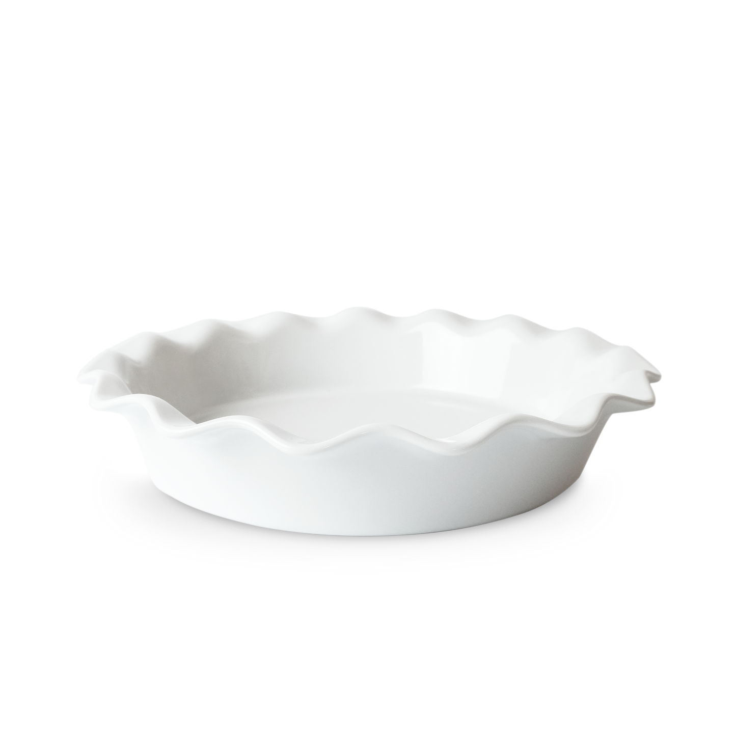 White ceramic pie dish with ruffled edge on a white background