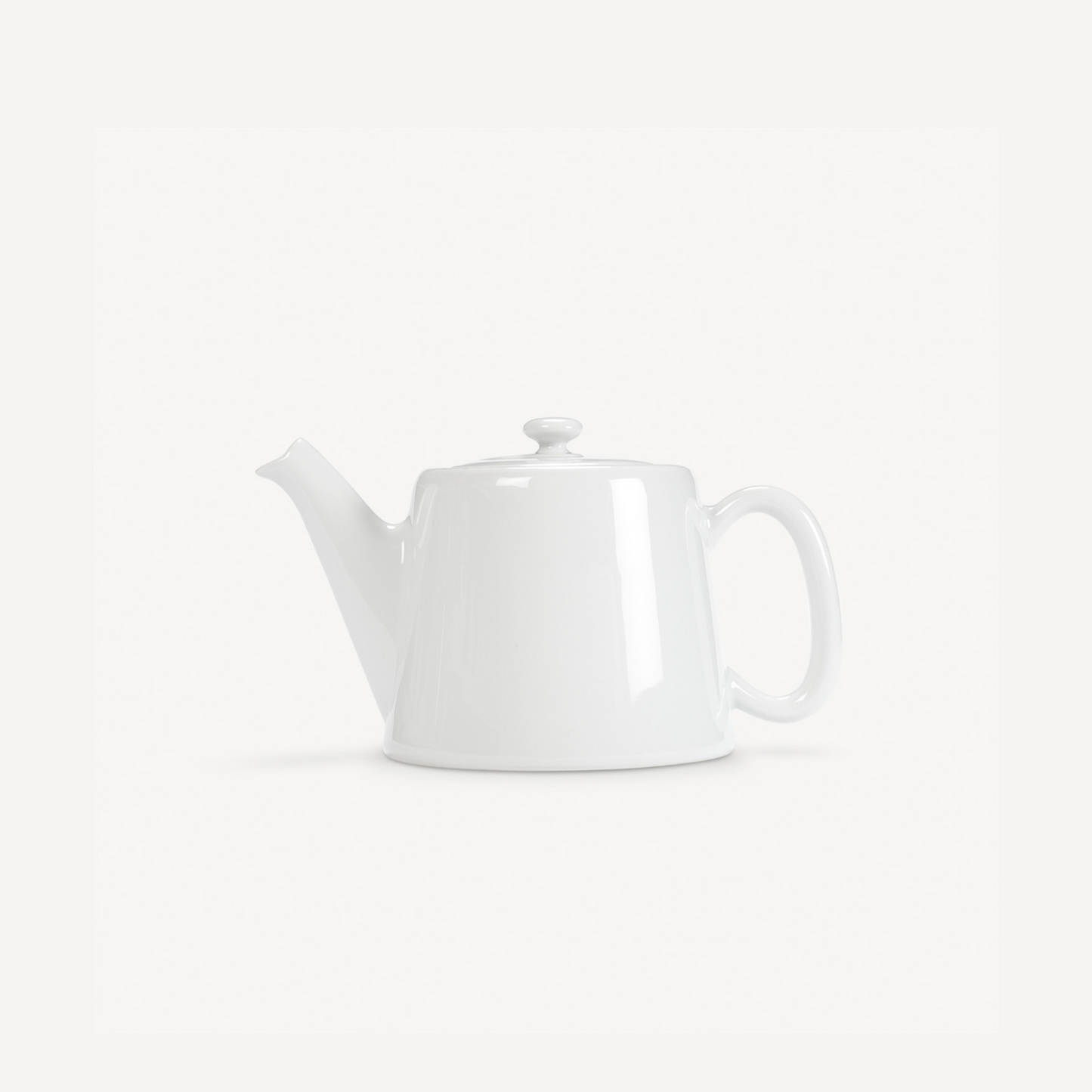 White teapot on a white background