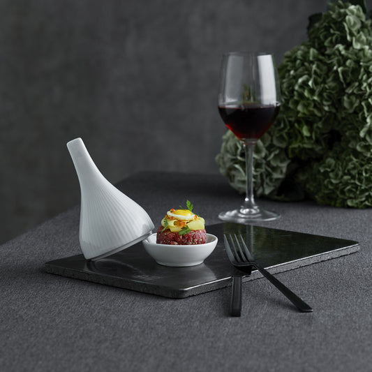 Dessert with a glass of red wine on a dark surface