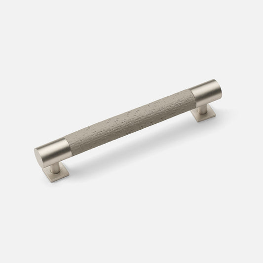 A small pull handle for furniture, featuring a gray textured grip with gold-colored metal ends.