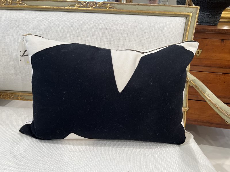 Black & Natural Throw Pillow 16"x 24" by Tara Shaw shown on sofa front side