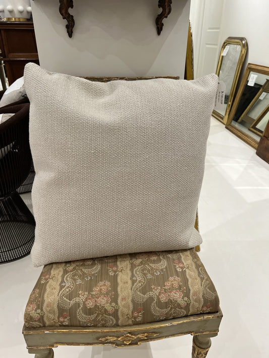 Flax Nubby Cream Throw Pillow 22" by Tara Shaw shown sitting on pretty gold side chair