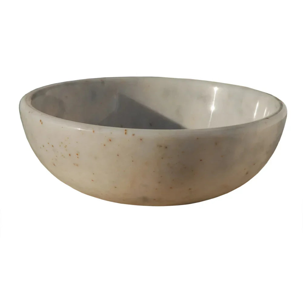 Beige ceramic bowl on a white background