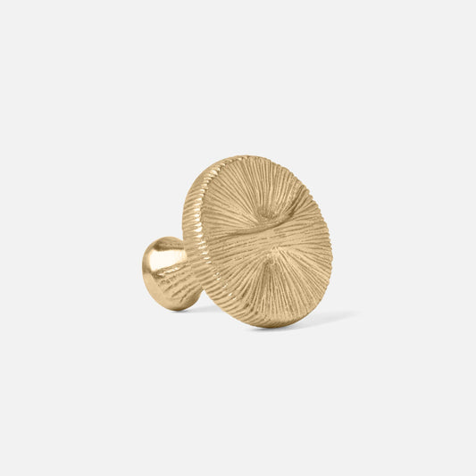 A silver round textured knob for cabinets or doors, with a metallic finish.