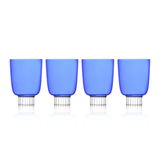 Set of four blue glasses with metal bases on a white background