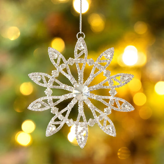 Decorative snowflake ornament on a blurred festive background