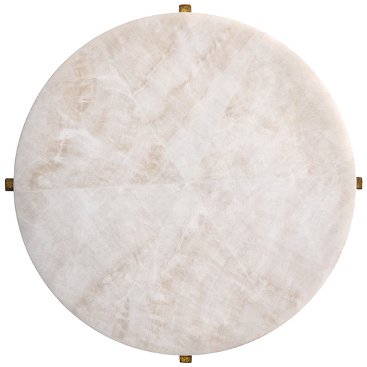 Round marble table with gold accents on a white background