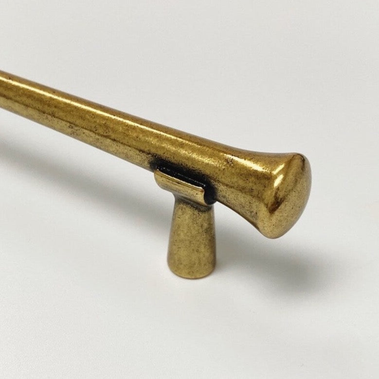 Gold metallic object on a white background