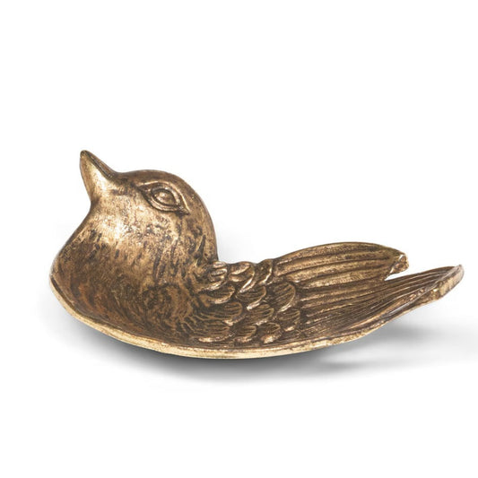 Bronze bird-shaped object on a white background