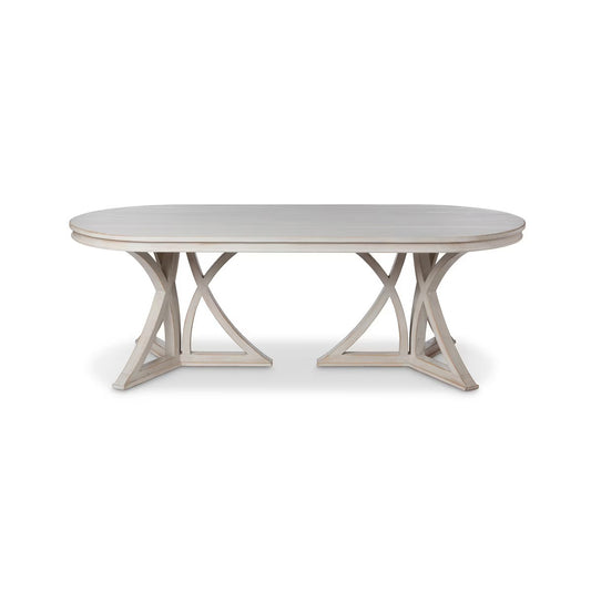 Round dining table with a light wood finish on a white background
