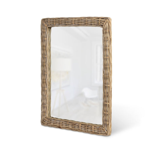 Rectangular mirror with wicker frame on a white background