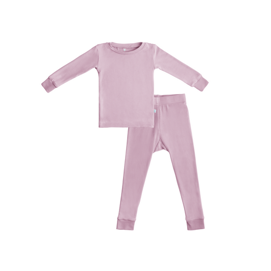 Pink children's pajama set on a white background
