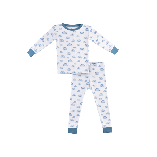 Children's pajama set with blue rainbow pattern on a white background