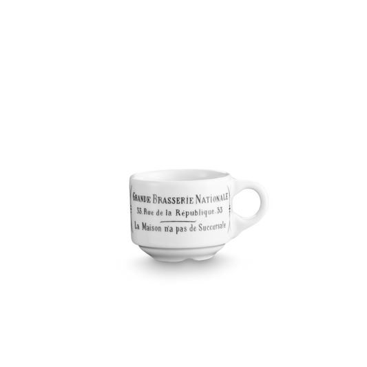 White ceramic cup with black text on a white background
