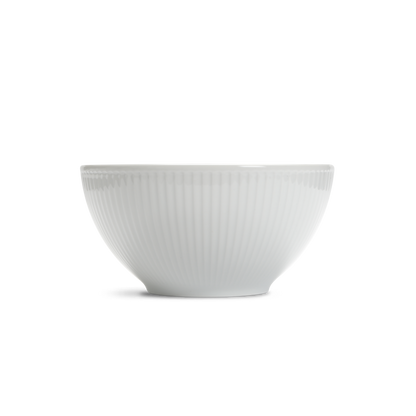 White ceramic bowl with ribbed texture on a white background