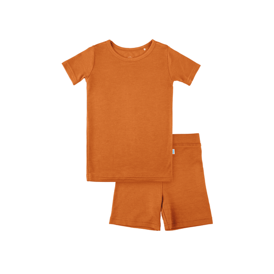 Orange t-shirt and shorts set on a white background