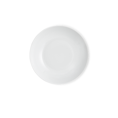 White ceramic plate on a white background