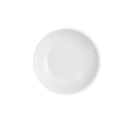 White ceramic plate on a white background