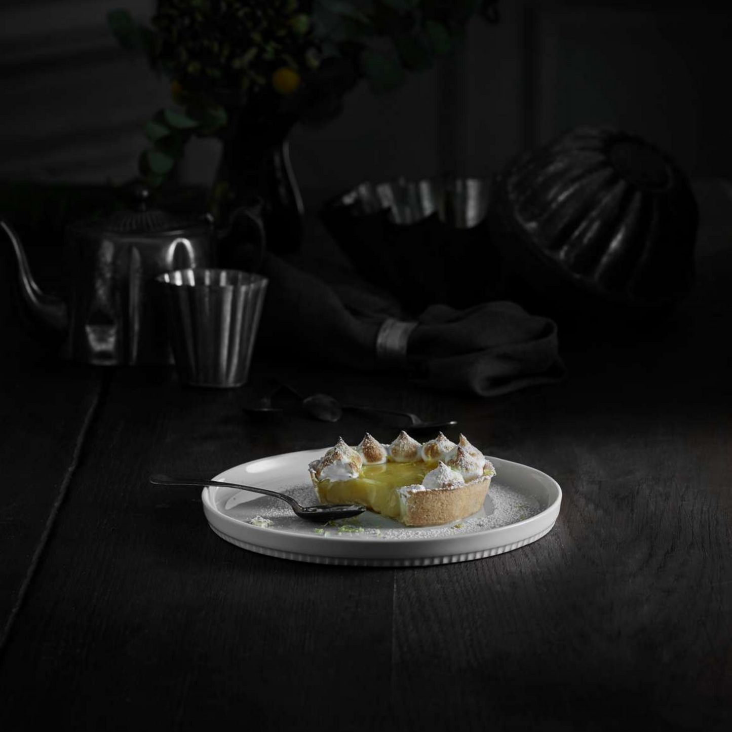 Pie on a white plate with a dark background