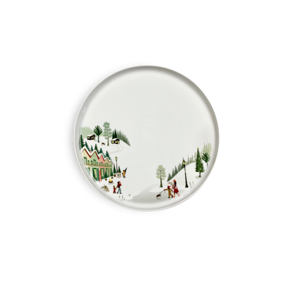 Decorative plate with a winter scene design on a white background