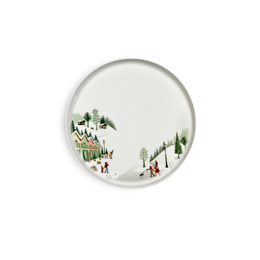 Decorative plate with a winter scene design on a white background