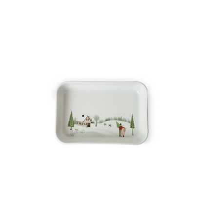 Rectangular ceramic tray with a winter scene design on a white background