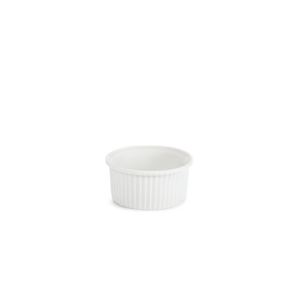White ceramic ramekin with textured interior on a white background