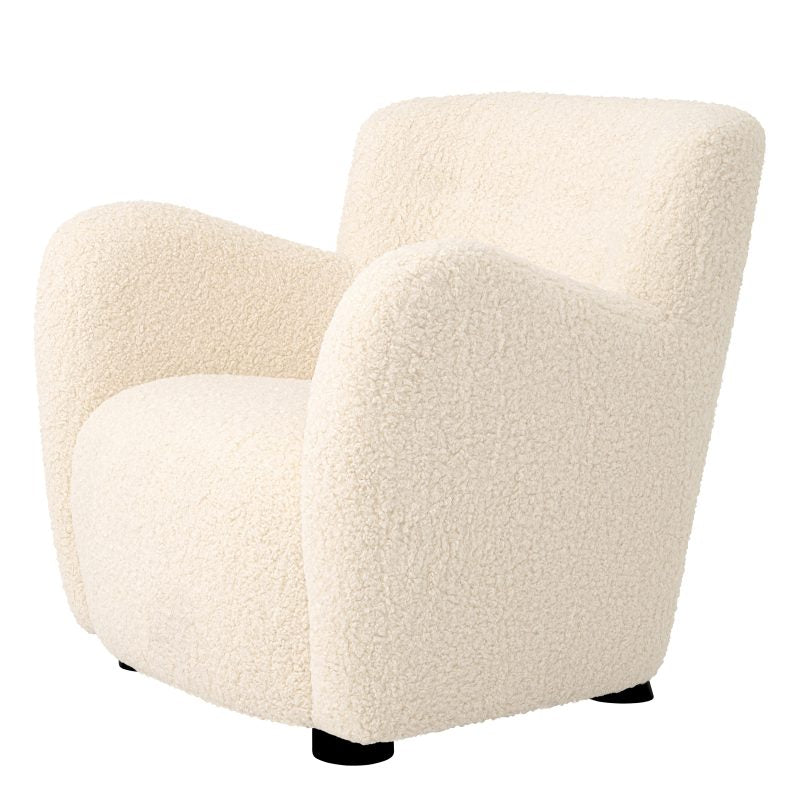 This Contemporary Chair by Tara Shaw piece provides a perfect spot to cozy up and unwind, side view