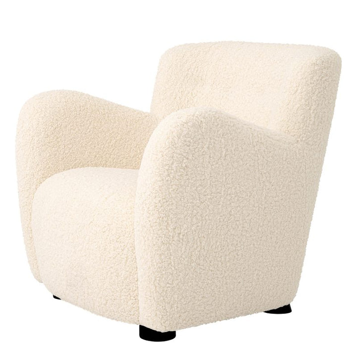 This Contemporary Chair by Tara Shaw piece provides a perfect spot to cozy up and unwind, side view