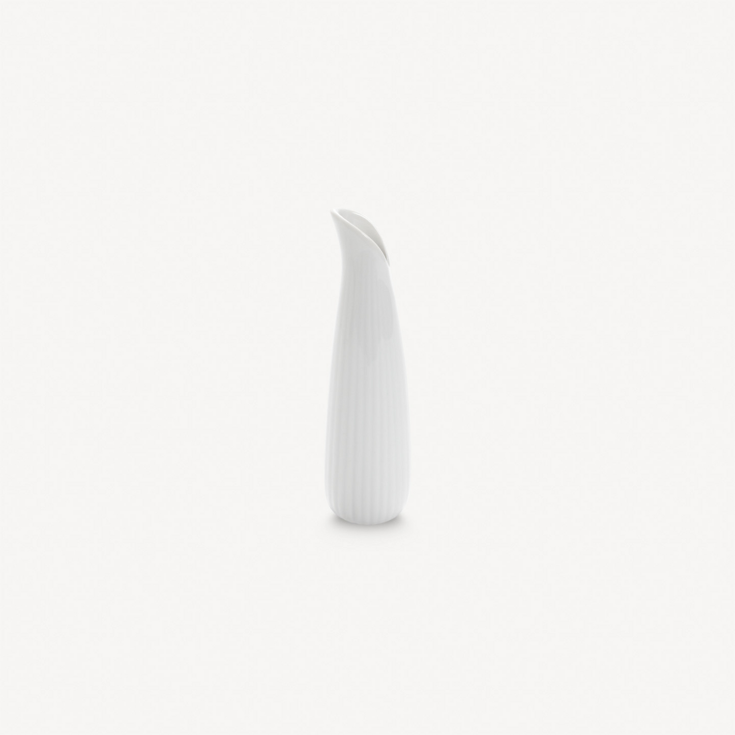 White ceramic vase on a light gray background