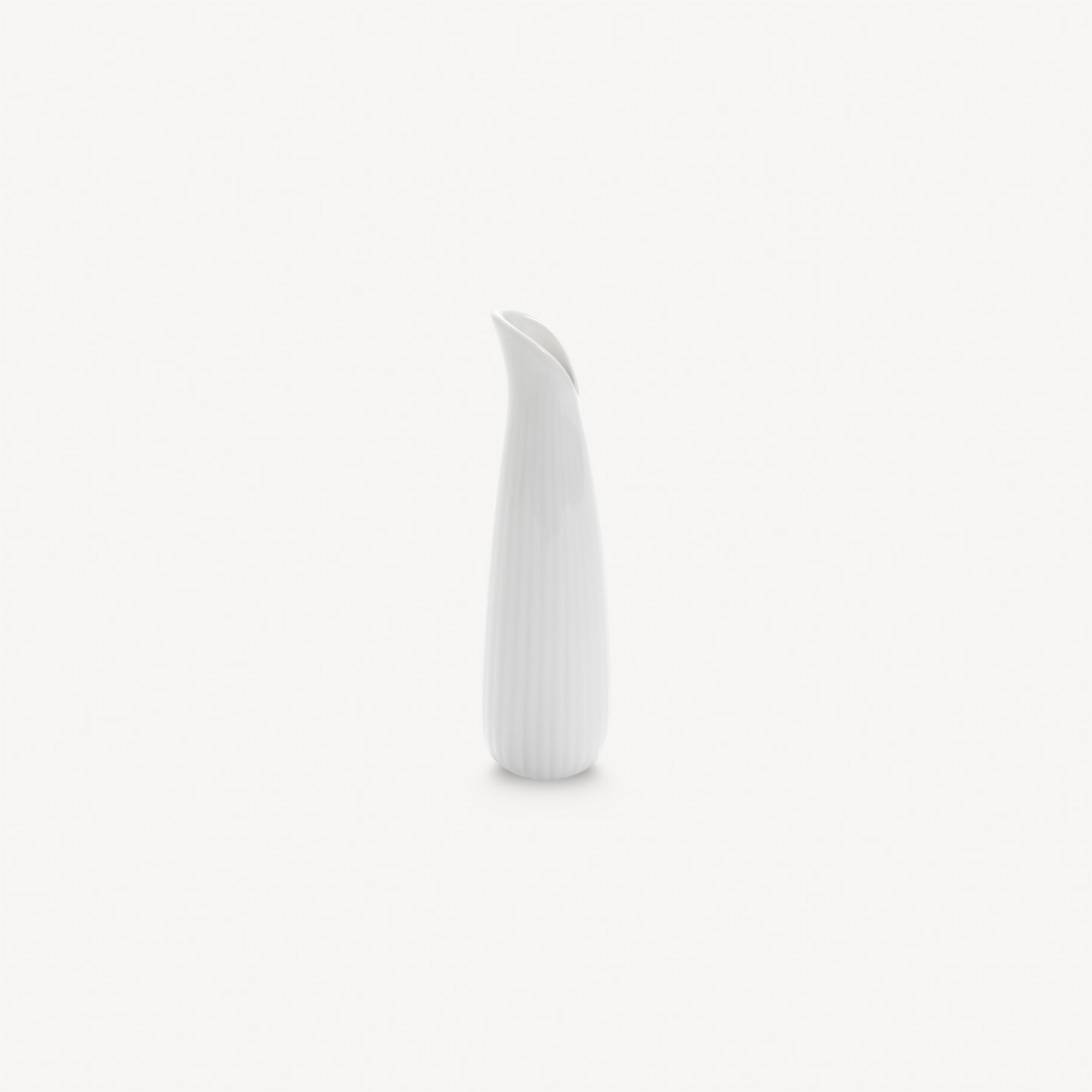 White ceramic vase on a light gray background