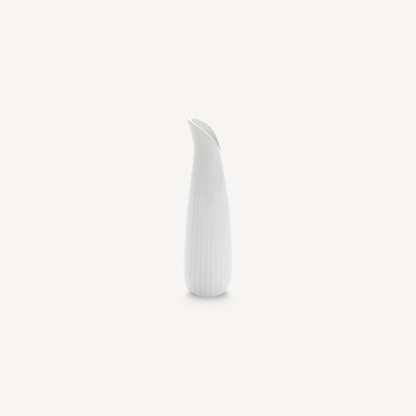 White ceramic vase on a light gray background