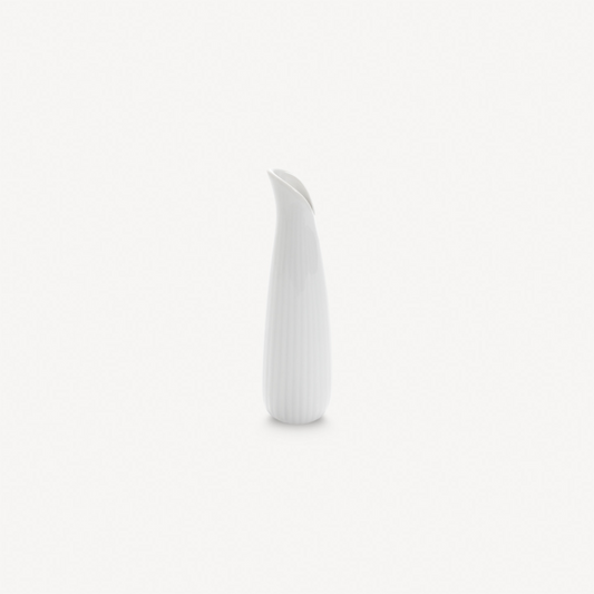 White ceramic vase on a light gray background