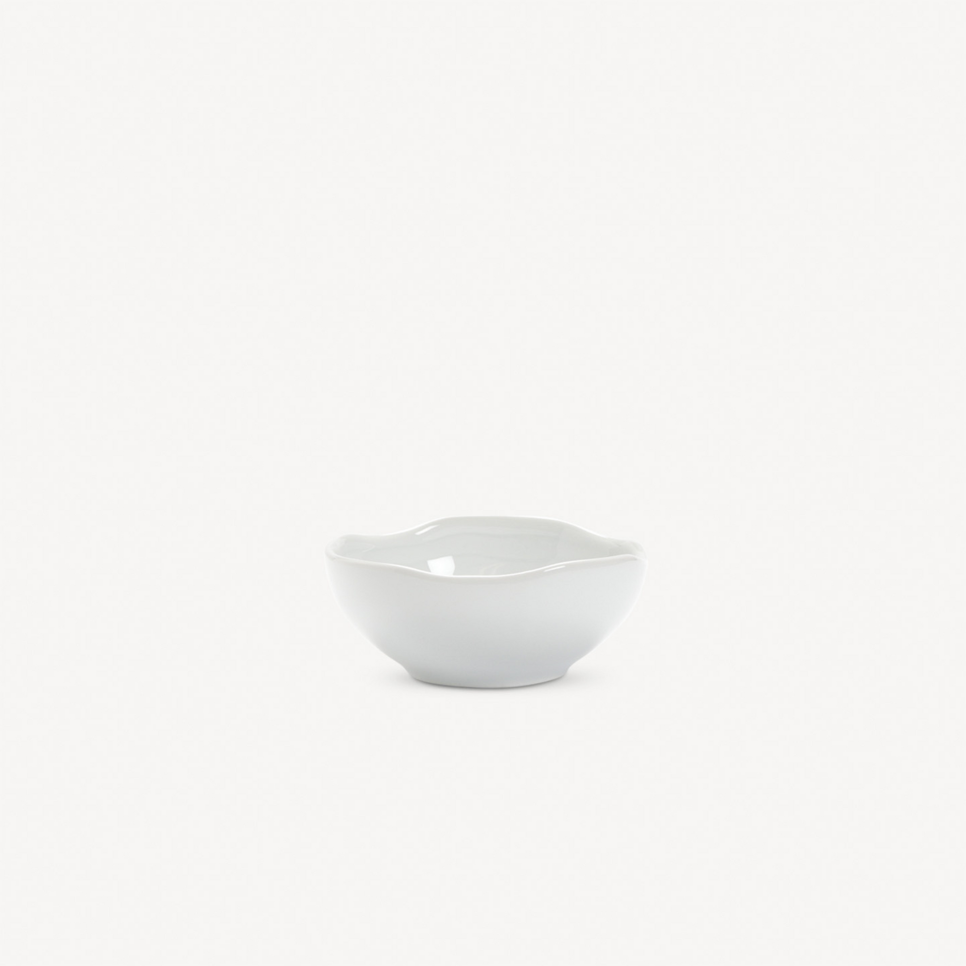 White ceramic bowl on a light gray background