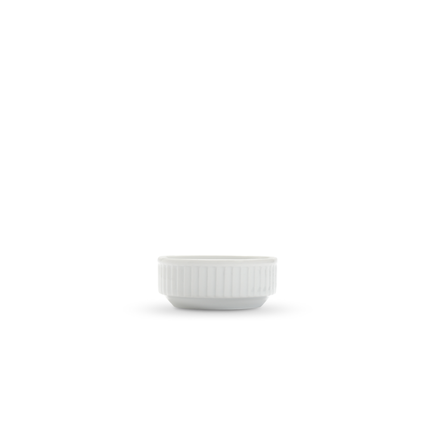 White ceramic sauce  bowl with ribbed texture on a white background