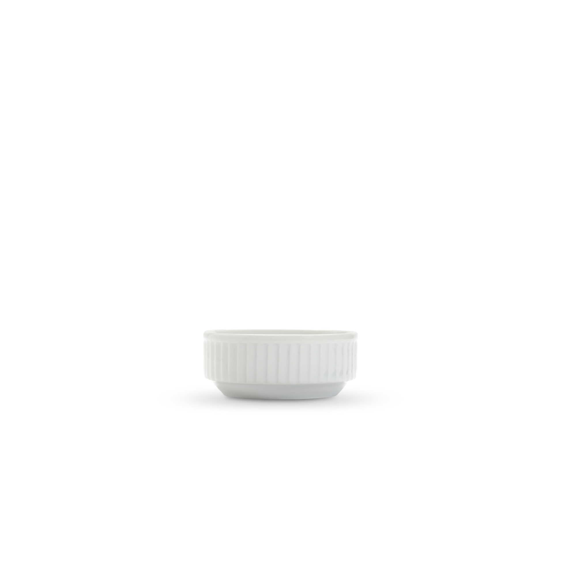 White ceramic sauce  bowl with ribbed texture on a white background