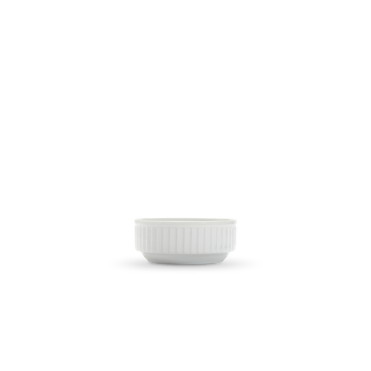 White ceramic sauce  bowl with ribbed texture on a white background