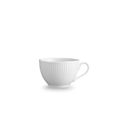 White ceramic teacup on a white background