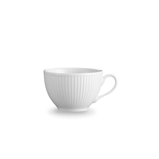 White ceramic cup with ribbed texture on a white background