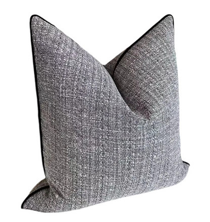 Gray textured throw pillow on a white background