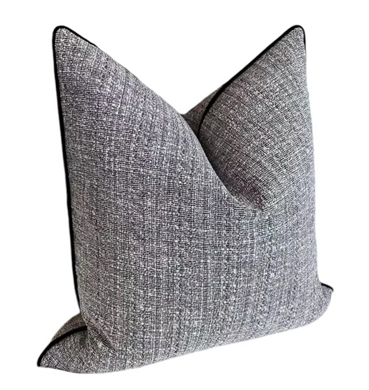 Gray textured throw pillow on a white background
