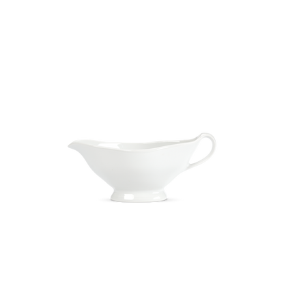 White ceramic gravy boat on a white background