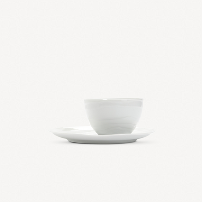 White ceramic cup and saucer on a white background