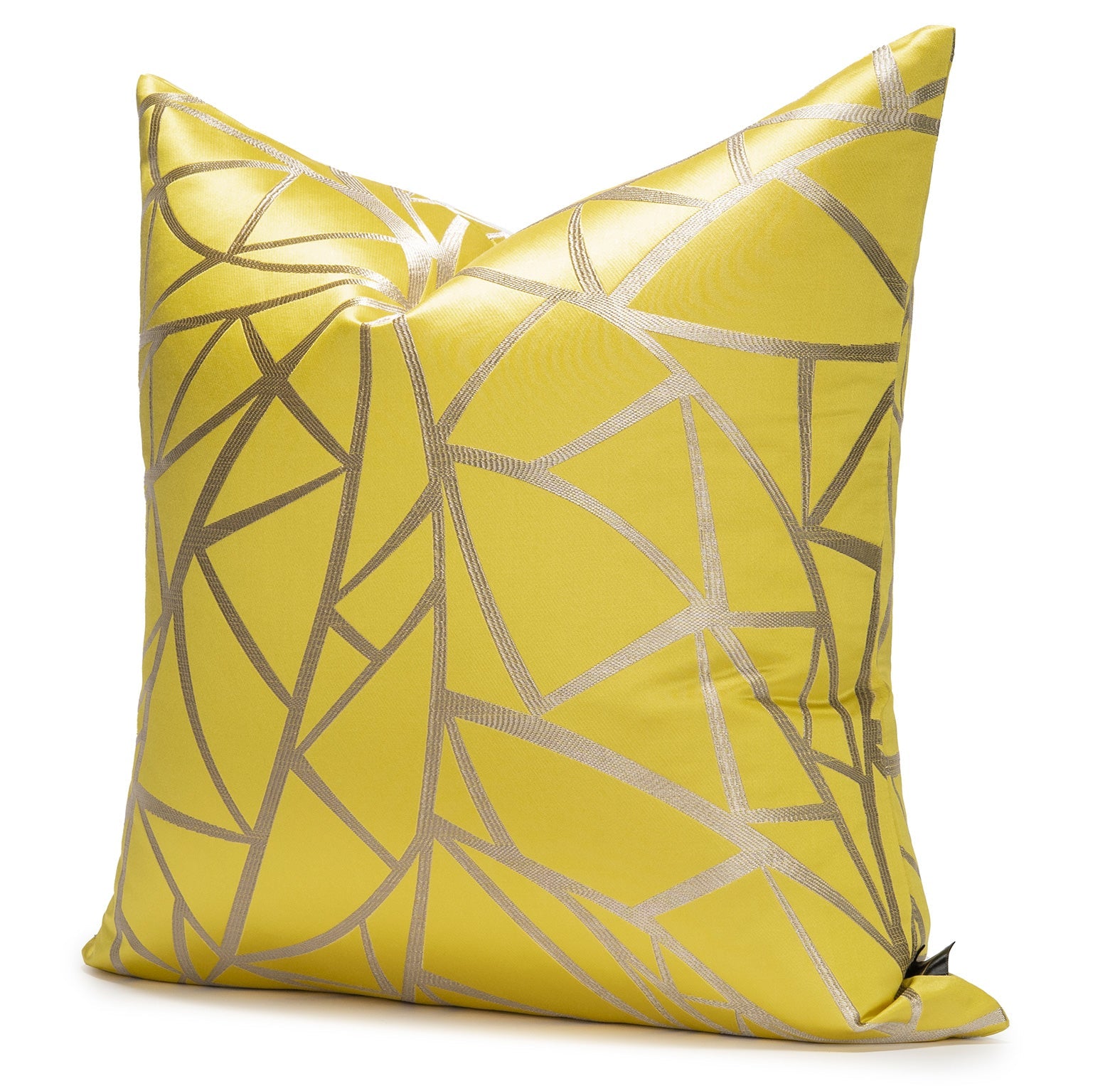 Yellow pillow with geometric pattern on a white background