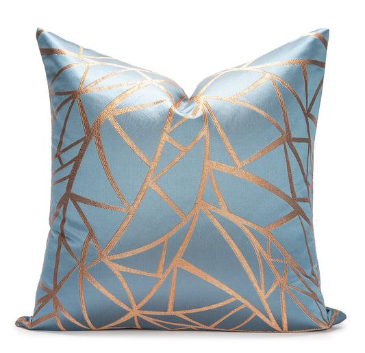 Decorative pillow with geometric pattern on a light blue background