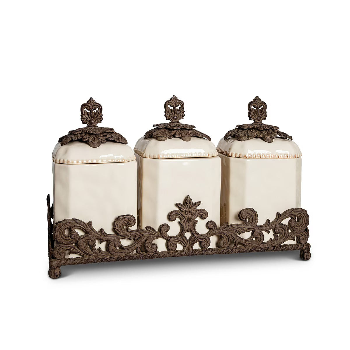 Decorative canister set with ornate metal stand on a white background