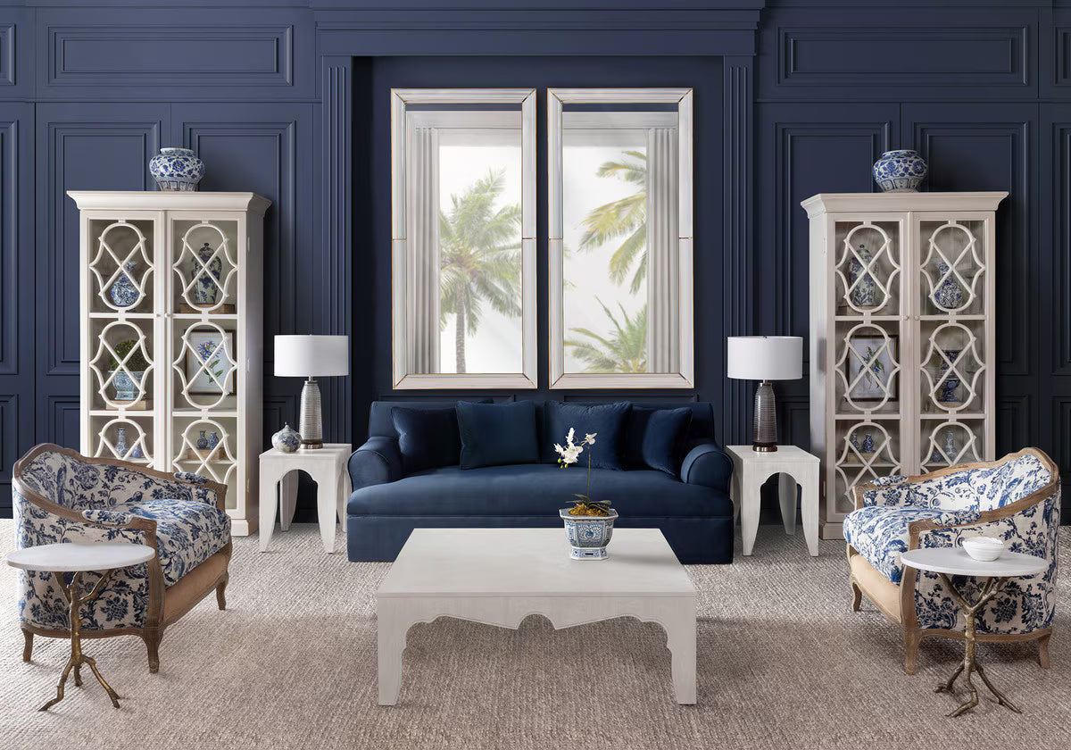 Living room with blue walls, furniture, and decorative elements.