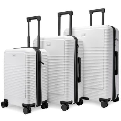 Set of three white suitcases with black handles and wheels on a white background