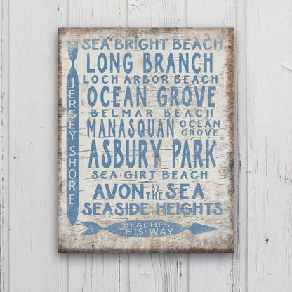 Decorative sign with jersey beach names on a wooden background