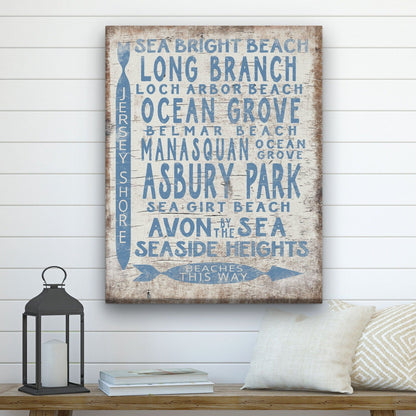 Decorative sign with beach names on a wall above a wooden bench.